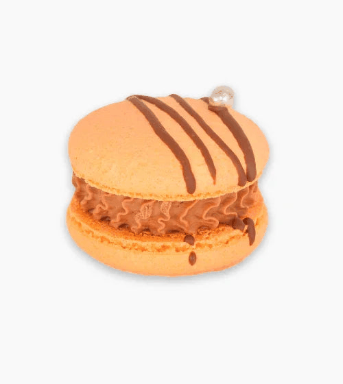 Chocolate Orange macaron with orange shells and chocolate drizzle