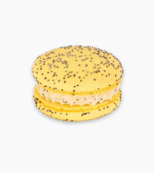 Bright yellow shells macaron with poppy seeds filled with tangy lemon cream