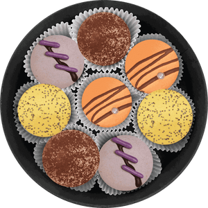 Citrus Glow box with tiramisu, chocolate orange, lemon, and lavender macarons featuring vibrant citrus and creamy textures