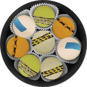 Tropical Delight set colorful tropical macarons with mango, orange, coconut, pistachio, and passionfruit flavors
